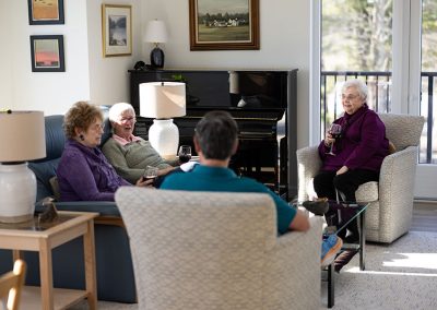 four people in apt living room