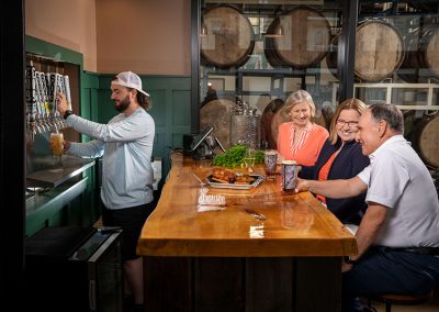 four people in brewery