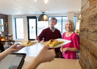 couple at cafe getting crepes