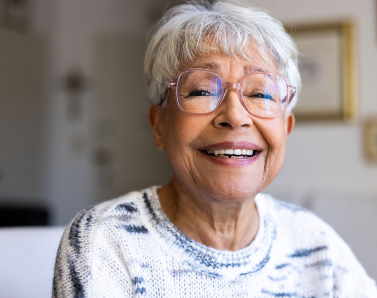 health svc gray hair lady with glasses smiling