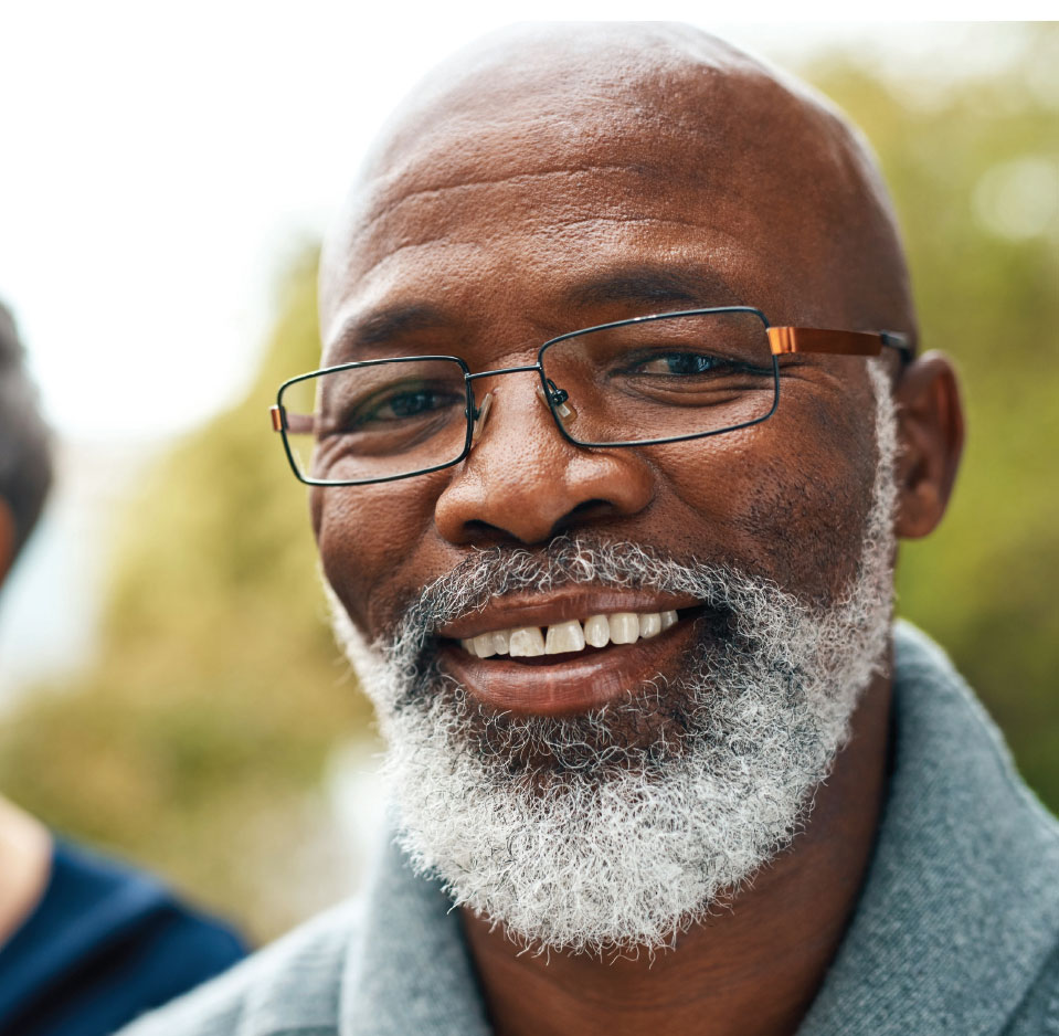 pricing black man with gray beard smiling