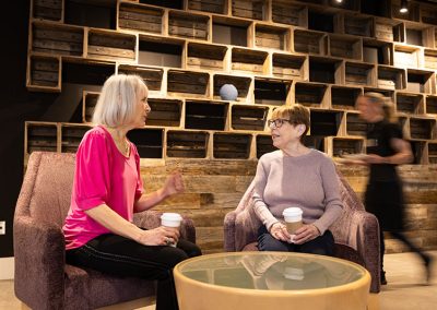 two women sitting in lounge