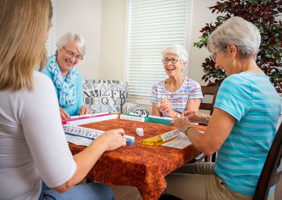 four people playing table game