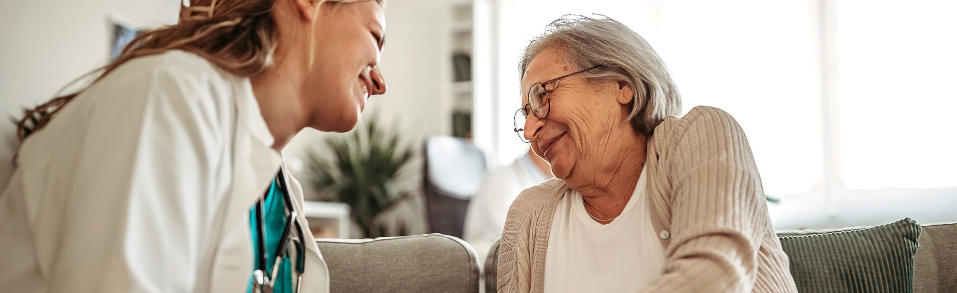 health svc header two women smiling at each other