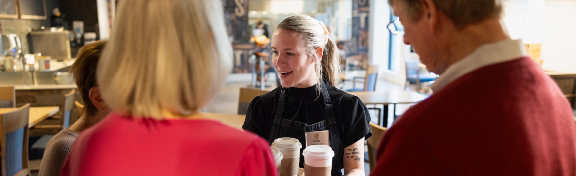 services and amenitiees header people in coffee shop 