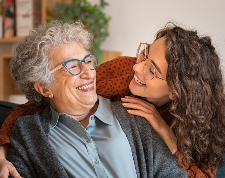 IL two women smiling at each other