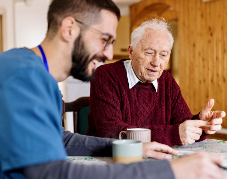 health svc young and older man in maroon shirt