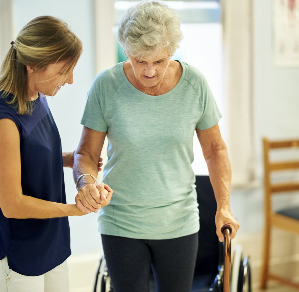 two women holding hands while doing physical therapy