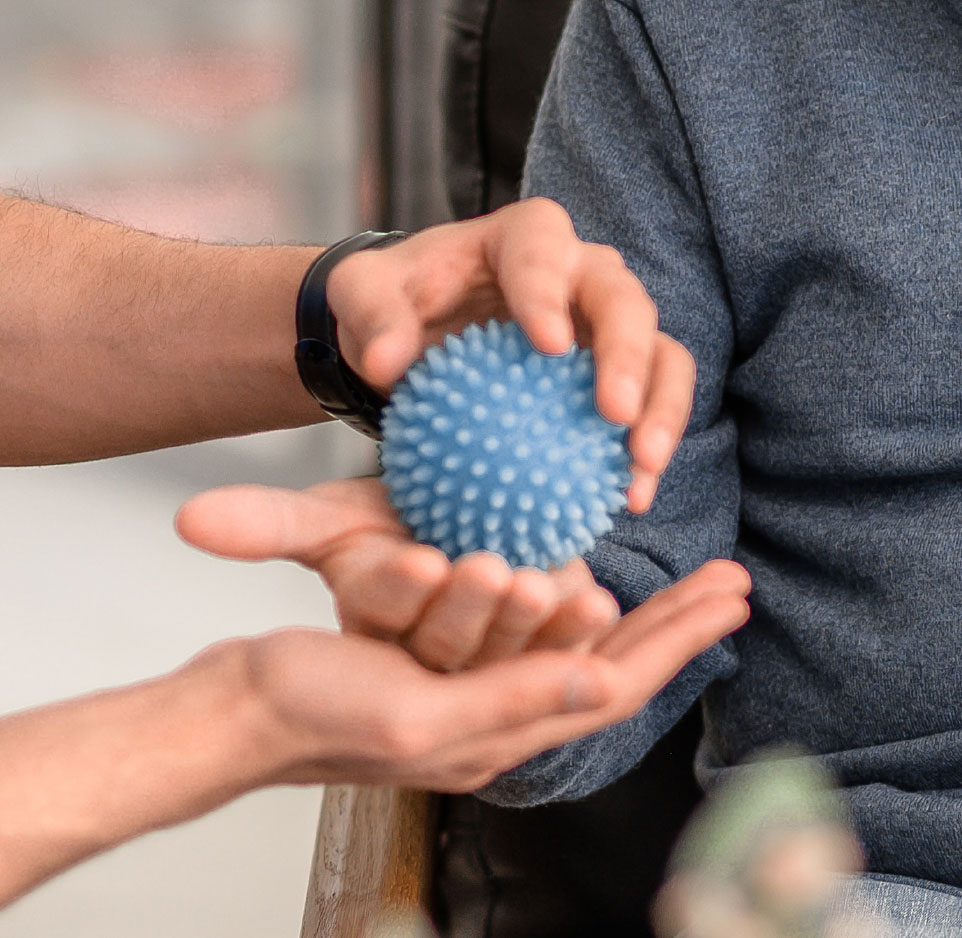 two hand with physical therapy hand ball