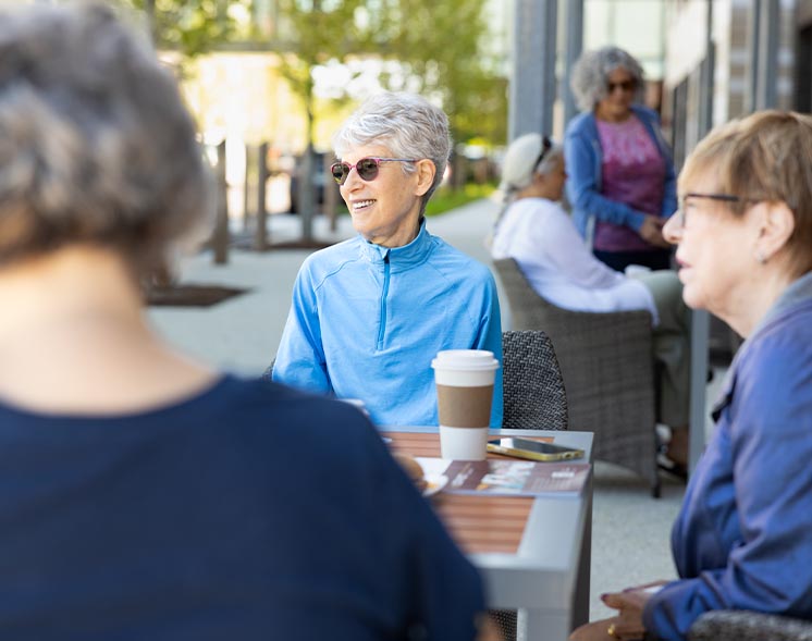 people sitting outside at cafe