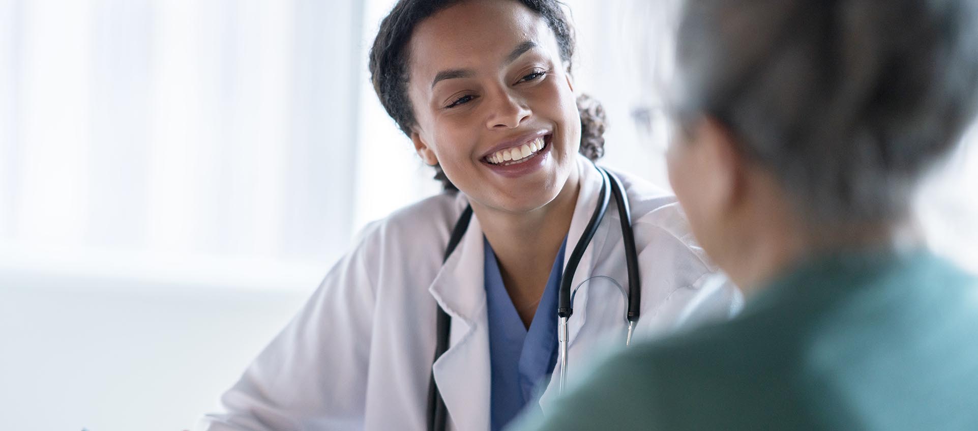 woman talking to doctor